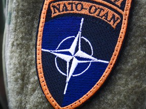 NATO - OTAN badge. Photographer: Beata Zawrzel/Getty Images/NurPhoto