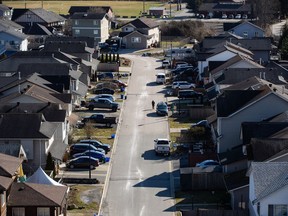 Houses are seen on Squamish Nation land in North Vancouver, B.C., Tuesday, Feb. 22, 2022. Canada Mortgage and Housing Corporation (CMHC) says residential mortgage debt grew by nine per cent last year compared with a year earlier for the fastest pace of growth since 2008.