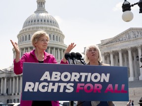 FILE - Sen. Elizabeth Warren, D-Mass., and Sen. Patty Murray, D-Wash., talk to reporters as the Supreme Court is poised to possibly overturn Roe v. Wade, at the Capitol in Washington, June 15, 2022. The Democratic National Committee is launching a digital ad campaign to energize its voters after last month's Supreme Court decision overturning Roe v. Wade. The ad campaign warns that Republicans' ultimate goal is to outlaw abortion nationwide.