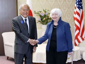 U.S. Treasury Secretary Janet Yellen, right, and Japan's Finance Minister Shunichi Suzuki shake hands during their meeting at the finance ministry in Tokyo, Tuesday, July 12, 2022. With thousands of sanctions already imposed on Russia to flatten its economy, the U.S. and its allies are working on new measures to starve the Russian war machine while also stopping the price of oil and gasoline from soaring to levels that could crush the global economy. (Kyodo News via AP)