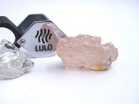 This photo supplied by Lucapa Diamond Company on Wednesday, July 27, 2022, shows the 170 carat pink diamond, right, recovered from Lulo, Angola. A big pink diamond of 170 carats has been discovered in Angola and is claimed to be the largest such gemstone found in 300 years. Called the "Lulo Rose," the diamond was found at the Lulo alluvial diamond mine. The mine's owner, the Lucapa Diamond Company, on Wednesday announced the discovery of the large pink diamond on its website. (Lucapa Diamond Company via AP)
