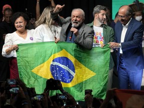 Brazil's former president who is running for reelection, Luiz Inacio Lula da Silva, center, speaks during a campaign rally in Brasilia, Brazil, Tuesday, July 12, 2022.
