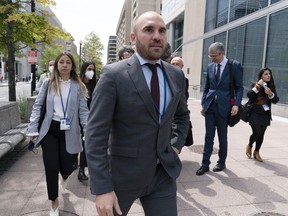 FILE - Argentina's Economy Minister Martin Guzman walks outside of the International Monetary Fund, IMF, building during the IMF Spring Meetings, in Washington, April 21, 2022. Guzman announced his resignation on Saturday, July 2, via twitter.