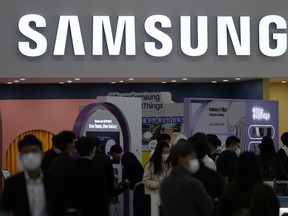 FILE - A logo of Samsung Electronics is seen at Korea Electronics Show in Seoul, South Korea, on Oct. 28, 2021. Samsung Electronics Co. on Thursday, July 28, 2022, reported it posted a 12% increase in operating profit for the second quarter of this year thanks to strong demand for server chips.