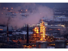 Petroleum cracking towers are seen illuminated by lights at the Lukoil-Nizhegorodnefteorgsintez petroleum refinery, operated by OAO Lukoil, in Nizhny Novgorod, Russia.