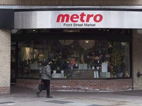 A woman walks pass a Metro grocery store in Toronto on Wednesday Nov. 1, 2017. Expect to learn more about how food inflation is affecting the bottom line for Canadian grocery stores when Metro Inc. releases its third-quarter results on Wednesday.THE CANADIAN PRESS/Doug Ives