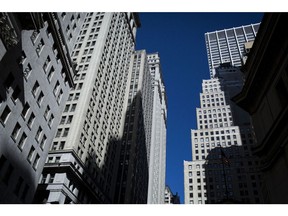 Buildings stand on Wall Street near the New York Stock Exchange (NYSE) in New York, U.S.