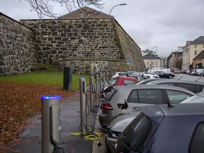 Electric vehicles at charging stations in Oslo. Photographer: Fredrik Bjerknes/Bloomberg