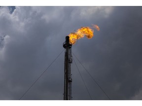 A gas flare stands at the Petroleos Mexicanos (PEMEX) Miguel Hidalgo Refinery in Tula, Hidalgo, Mexico, on Tuesday, April 18, 2017. The $2.1 billion project to develop and operate a coker unit at the Pemex's Tula refinery will turn lower-value fuel into products like gasoline and diesel. Photographer: Yael Martinez/Bloomberg