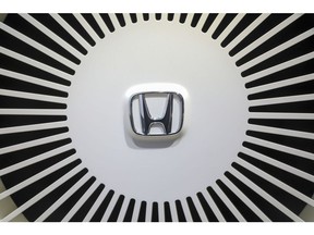 A Honda Motor Co. logo sits in the wheel on a Urban EV concept automobile on day two of the 88th Geneva International Motor Show in Geneva, Switzerland, on Wednesday, March 7, 2018. The show opens to the public on March 8, and will showcase the latest models from the world's top automakers. Photographer: Chris Ratcliffe/Bloomberg