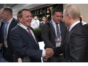 Gerhard Schroeder and Vladimir Putin. Photographer: Alexey Druzhinin/AFP/Getty Images