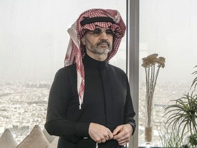 Prince Alwaleed Bin Talal, Saudi billionaire and founder of Kingdom Holding Co., poses for a photograph in the penthouse office of Kingdom Holding Co., following his release from 83 days of detention in the Ritz-Carlton hotel in Riyadh, Saudi Arabia, on Sunday, March 18, 2018. Alwaleed was the most prominent among hundreds of Saudi businessmen, government officials and princes who were swept up in November in what the government called a crackdown on corruption.