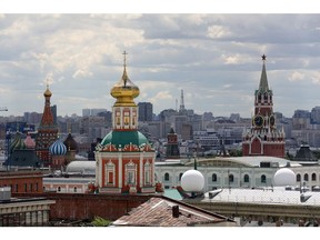 St Basil's cathedral, left, and the Spasskaya tower, right, stand on the city skyline in Moscow, Russia, on Saturday, June 9, 2018. FIFA expects more than three billion viewers for the World Cup that begins this week in Russia. Photographer: Andrey Rudakov/Bloomberg