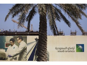 Cranes operate at the construction site of a new building project at the Saudi Aramco oil company's compound in Dhahran, Saudi Arabia, on Wednesday, Oct. 3, 2018. Speculation is rising over whether Saudi Arabia will break with decades-old policy by using oil as a political weapon, as it vowed to hit back against any punitive measures after the disappearance of government critic Jamal Khashoggi. Photographer: Simon Dawson/Bloomberg