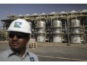 An employee visits the Natural Gas Liquids (NGL) facility at Saudi Aramco's Shaybah oil field in the Rub' Al-Khali desert, also known as the 'Empty Quarter,' in Shaybah, Saudi Arabia, on Tuesday, Oct. 2, 2018. Saudi Arabia is seeking to transform its crude-dependent economy by developing new industries, and is pushing into petrochemicals as a way to earn more from its energy deposits. Photographer: Simon Dawson/Bloomberg