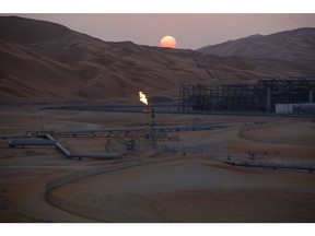 A flame burns from a stack at the oil processing facility at Saudi Aramco's Shaybah oil field in the Rub' Al-Khali desert, also known as the 'Empty Quarter,' in Shaybah, Saudi Arabia, on Tuesday, Oct. 2, 2018. Saudi Arabia is seeking to transform its crude-dependent economy by developing new industries, and is pushing into petrochemicals as a way to earn more from its energy deposits.