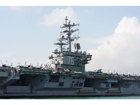 The USS Ronald Reagan, a Nimitz-class aircraft carrier and part of the U.S Navy 7th Fleet, sits anchored in Hong Kong, China, on Wednesday, Nov. 21, 2018. A trio of U.S. naval vessels anchored in Hong Kong on Wednesday, the first U.S. naval ships to harbor in the city since China barred entry to another American ship in September, in a sign of easing military tensions between the two powers. Photographer: Anthony Kwan/Bloomberg
