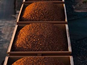 A freight train carrying iron ore travels towards Port Hedland, Australia, on Tuesday, March 19, 2019. A two-day drive from the nearest big city, Perth, Port Hedland is the nexus of Australia's iron-ore industry, the terminus of one of Australia's longest private railways that hauls ore about 400 kilometers (250 miles) from the mines of BHP Group and Fortescue Metals Group Ltd. The line ran a record-breaking test train weighing almost 100,000 tons that was more than 7 kilometers long in 2001, and even normal trains haul up to 250 wagons of ore. Photographer: Ian Waldie/Bloomberg