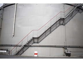 A staircase runs up the side of a storage silo at the Erik Walther GmbH oil terminal on the River Rhine in Schweinfurt, Germany, on Tuesday, June 11, 2019. Oil headed for a weekly decline as the tanker attacks in the Middle East provided only a relatively small boost to prices that have been hammered by a deepening trade war and swelling U.S. stockpiles.
