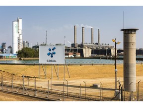 Emissions rise from towers at the Sasol Ltd. Sasol One Site in Sasolburg, South Africa, on Wednesday, Aug. 7, 2019. Sasol said some of its South African plants are under threat from sulfur dioxide emission standards that it will need to comply with by 2025. Photographer: Waldo Swiegers/Bloomberg