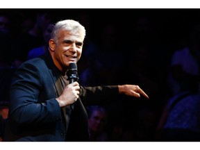 Yair Lapid, chairman of the Yesh Atid party, gestures to the audience while speaking in the final campaign event before the election in Tel Aviv, Israel, on Sunday, Sept. 15, 2019. Polls ahead of Israel's Sept. 17 election suggest a tight race between Prime Minister Benjamin Netanyahu's Likud and former military chief Benny Gantz's Blue and White. Photographer: Kobi Wolf/Bloomberg
