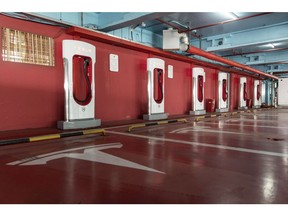 Electric vehicle charging stations stand in a Tesla Inc. Supercharger station at a parking garage in Shanghai, China, on Saturday, Nov. 2, 2019. After starting construction this year, Tesla's new factory is already producing electric vehicles on a trial basis.