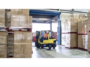 A forklift truck moves goods in a warehouse operated by George Baker Shipping Ltd. in Felixstowe, U.K., on Thursday, Nov. 21, 2019. Across British industry, Brexit remains a dirty wordunless you're a customs agent.