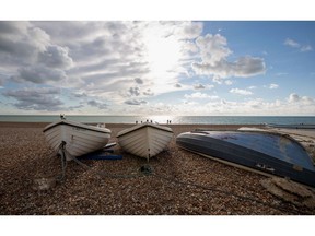 Boats on Seaford Beach in Seaford, East Sussex, United Kingdom.