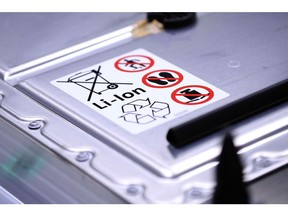 A recycling symbol and handling instructions sit on a lithium-ion automotive battery pack for a Volkswagen AG (VW) ID.3 electric automobile at the automaker's factory in Zwickau, Germany, on Tuesday, Feb. 25, 2020. The worlds largest automaker plans to eliminate carbon dioxide emissions by 2050 and will invest 33 billion euros through 2024 to build the industrys biggest fleet of electric cars.