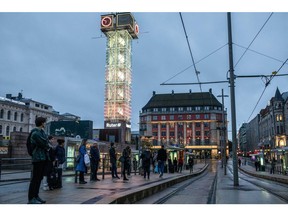 Commuters wait for a tram at the "Jernbanetorget" stop in Oslo, Norway, on Wednesday, Sept. 23, 2020. Norway's central bank ruled out an increase in interest rates for the coming years, citing a highly uncertain economic environment due to the ongoing pandemic.