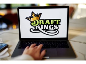 The logo for DraftKings is displayed on a laptop computer in an arranged photograph taken in Little Falls, New Jersey, U.S., on Wednesday, Oct. 7, 2020. The pricing of a DraftKings Inc. share sale combined with a fresh wave of Covid-19 infections across the National Football League sent shares of the online gaming company tumbling this week. Photographer: Gabby Jones/Bloomberg