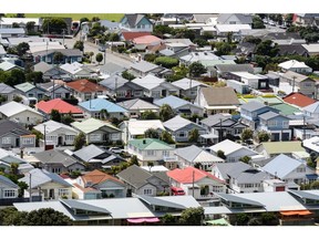 Houses in the Lyall Bay suburb of Wellington, New Zealand, on Saturday, Nov. 28, 2020. A housing frenzy at the bottom of the world is laying bare the perils of ultra-low interest rates.