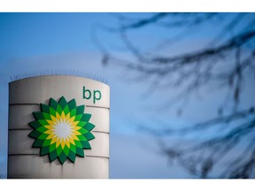 A BP logo on totem sign at a BP Plc petrol station on the side of the North Circular road in London, U.K., on Tuesday, Feb. 2, 2021. BP Plc showed that Big Oil has barely begun to heal the wounds from last year's historic slump, posting earnings that fell short of expectations on weak fuel sales, refining margins and gas trading.