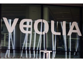 A logo on the windows of the Veolia Environnement SA headquarters in Paris, France, on Wednesday, May 12, 2021. Veolia, the world's largest waste and water utility, shook the industry last summer when it launched a takeover offer for Suez SA, triggering a seven-month feud in courts and through media. Photographer: Nathan Laine/Bloomberg