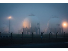 Dawn fog shrouds Horton sphere storage pressure vessels at the Total SE Grandpuits oil refinery in Grandpuits-Bailly-Carrois, France, on Thursday, May 27, 2021. The French energy giant holds its annual general meeting on May 28.