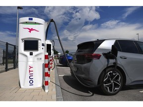 A Volkswagen ID.3 charges beside a Tesla Inc. Model S electric automobile at an Ionity GmbH charging station at motorway service area in Samerberg near Rosenheim, Germany, on Tuesday, June 29, 2021. Royal Dutch Shell Plc and Renault SA are among those interested in taking a stake in Volkswagen-backed electric vehicle charging group Ionity GmbH, Reuters reports, citing two unidentified people familiar with the matter. Photographer: Andreas Gebert/Bloomberg