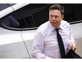 Elon Musk, chief executive officer of Tesla Inc., arrives at court during the SolarCity trial in Wilmington, Delaware, U.S., on Tuesday, July 13, 2021. Musk was cool but combative as he testified in a Delaware courtroom that Tesla's more than $2 billion acquisition of SolarCity in 2016 wasn't a bailout of the struggling solar provider.