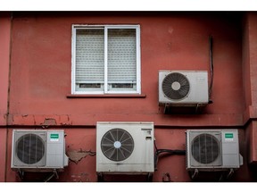 Air conditioning units on the exterior of a residential apartment building in Barcelona, Spain, on Thursday, July 29, 2021. Scorching heat is boosting electricity prices across Europe, adding to a long list of factors that have sent power costs surging this summer.