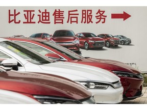 An advertisement features the BYD Co. range of vehicles at the company's showroom in Beijing, China, on Wednesday, Aug. 25, 2021.  Photographer: Qilai Shen/Bloomberg