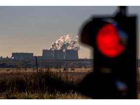 A traffic light marks the entrance to the Jaenschwalde open-cast lignite mine in Grieen, near the Jaenschwalde lignite-fired power station in Jaenschwalde, Germany, on Thursday, Oct. 28, 2021. The G-20 is meeting in Rome this weekend right before COP26 in Glasgow, the United Nations gathering that aims to set specific goals to wean nations off coal and other noxious substances for good. Photographer: Krisztian Bocsi/Bloomberg