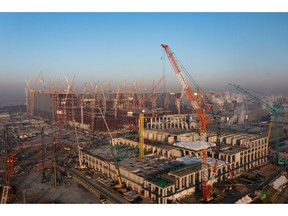 Cranes stand on a construction site at the Samsung Electronics Co. P3 semiconductor manufacturing plant in Pyeongtaek, Gyeonggi Province, South Korea, on Thursday, Jan. 6, 2022. Samsung Electronics will releases its preliminary fourth quarter earnings on Jan. 7.
