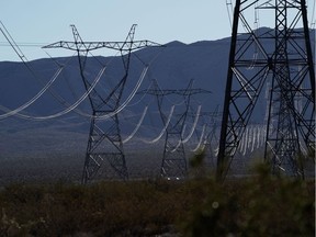 Power lines and transmission towers near the Ivanpah Solar Electric Generating System in the Mojave Desert in San Bernardino County, California, U.S., on Saturday, Feb. 19. 2022. California aims to end greenhouse gas emissions from its electricity grid by 2045. Photographer: Bing Guan/Bloomberg