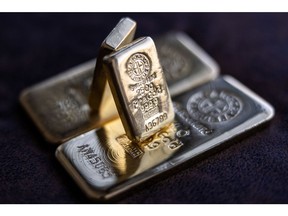 Two Argor-Heraeus SA 250 gram gold bars on top of one kilogram gold bars at Solar Capital Gold Zrt. arranged in Budapest, Hungary, on Tuesday, March 22, 2022. Gold edged higher in Asian trading -- following its biggest weekly drop since June -- as investors weighed monetary policy tightening in the U.S. against the impact of the Russia-Ukraine war. Photographer: Akos Stiller/Bloomberg