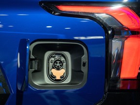 The charging port of a 2024 Chevrolet Silverado EV RST all-electric pickup truck during the 2022 New York International Auto Show (NYIAS) in New York, U.S. on Wednesday, April 13, 2022. The NYIAS returns after having canceled for two years due to the Covid-19 pandemic.  Photographer: Jeenah Moon/Bloomberg