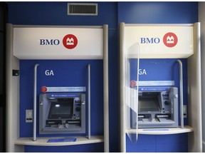 Automated teller machines (ATMs) at a Bank of Montreal (BMO) bank branch in Montreal, Quebec, Canada, on Thursday, April 28, 2022. Five Canadian banks had their price targets cut an average of 6% at RBC Capital Markets on prospects that escalating macro risks could weigh on profits. Photographer: Christinne Muschi/Bloomberg
