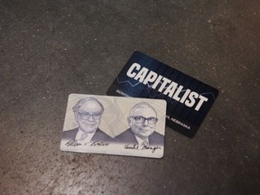 Capitalist cards offered during a shareholders shopping day ahead of the Berkshire Hathaway annual meeting in Omaha, Nebraska, US, on Friday, April 29, 2022. After hanging in the shadows for most of the pandemic, Warren Buffet and his deputies have been ramping up Berkshire Hathaway Inc.s acquisition machine -- snapping up shares of Occidental Petroleum Corp. and HP Inc. and striking an .6 billion deal to buy Alleghany Corp.