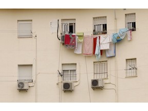 Air conditioning units on residential building during a heat wave in Seville. Photographer: Marcelo del Pozo/Bloomberg