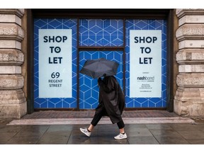 A pedestrian walks past a vacant retail space along Regent Street in central London, Britain, Wednesday, June 29, 2022. Regent Street, London's main shopping thoroughfare, is struggling to clear lingering effects of Covid-19. Photographer: Hollie Adams/Bloomberg