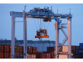 A transfer crane at a shipping terminal at dusk in Yokohama, Japan, on Monday, July 18, 2022. Japan is scheduled to release trade balance figures on July 21.
