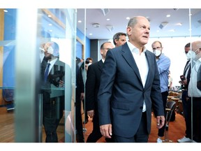 Olaf Scholz, Germany's chancellor, departs his inaugural summer news conference in Berlin, Germany, on Thursday, Aug. 11, 2022. Scholz promised citizens more financial assistance, with his government working on another relief package, as Germany scrambles to deal with surging energy prices brought on by Russia's move to cut natural gas supplies.